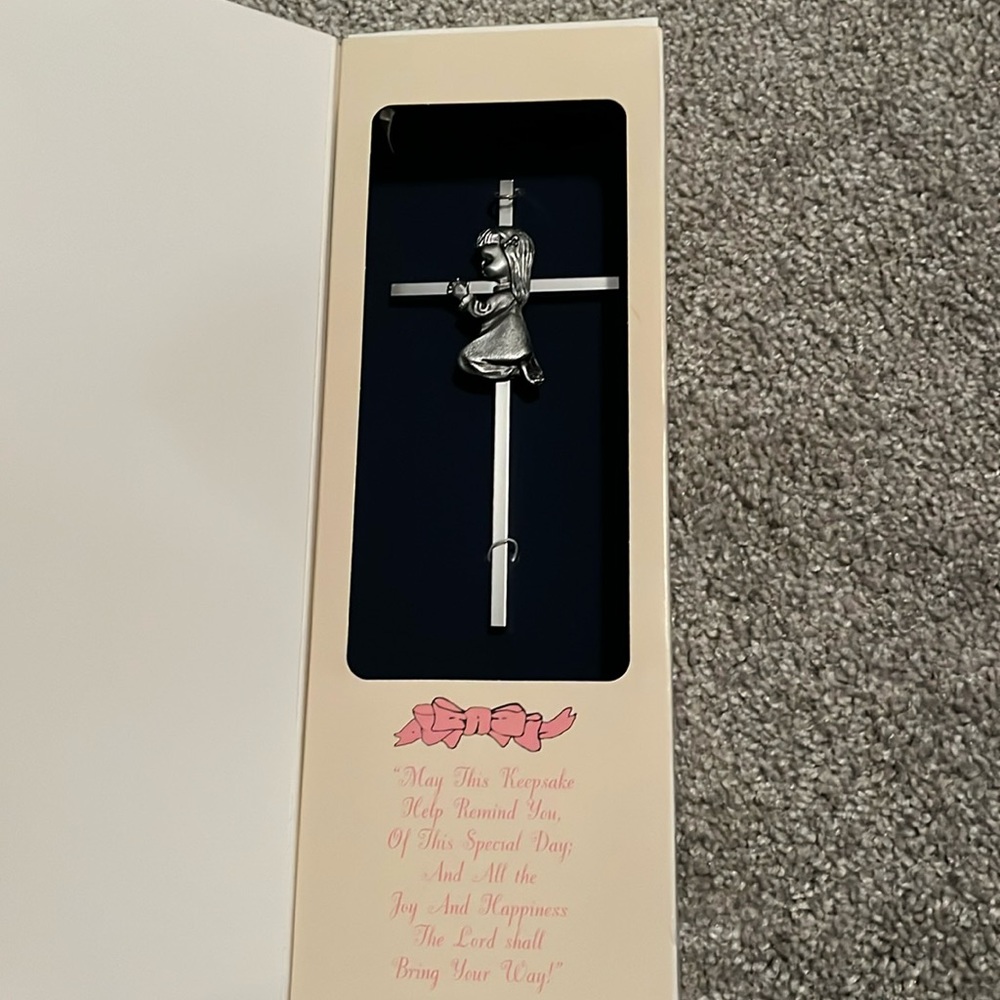 Silver cross.  Girl praying